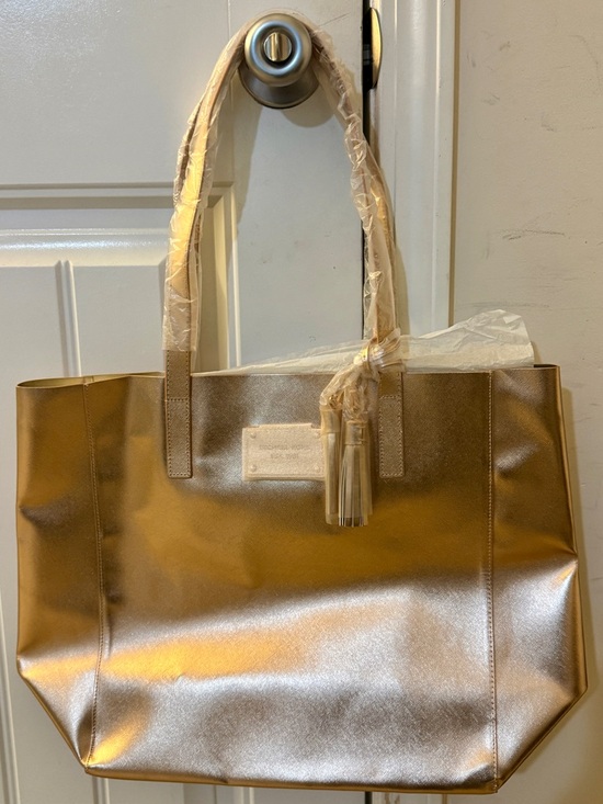 Michael Kors Handbags - New! Authentic Michael Kors Metallic Rose Gold Tote Bag with Tassel